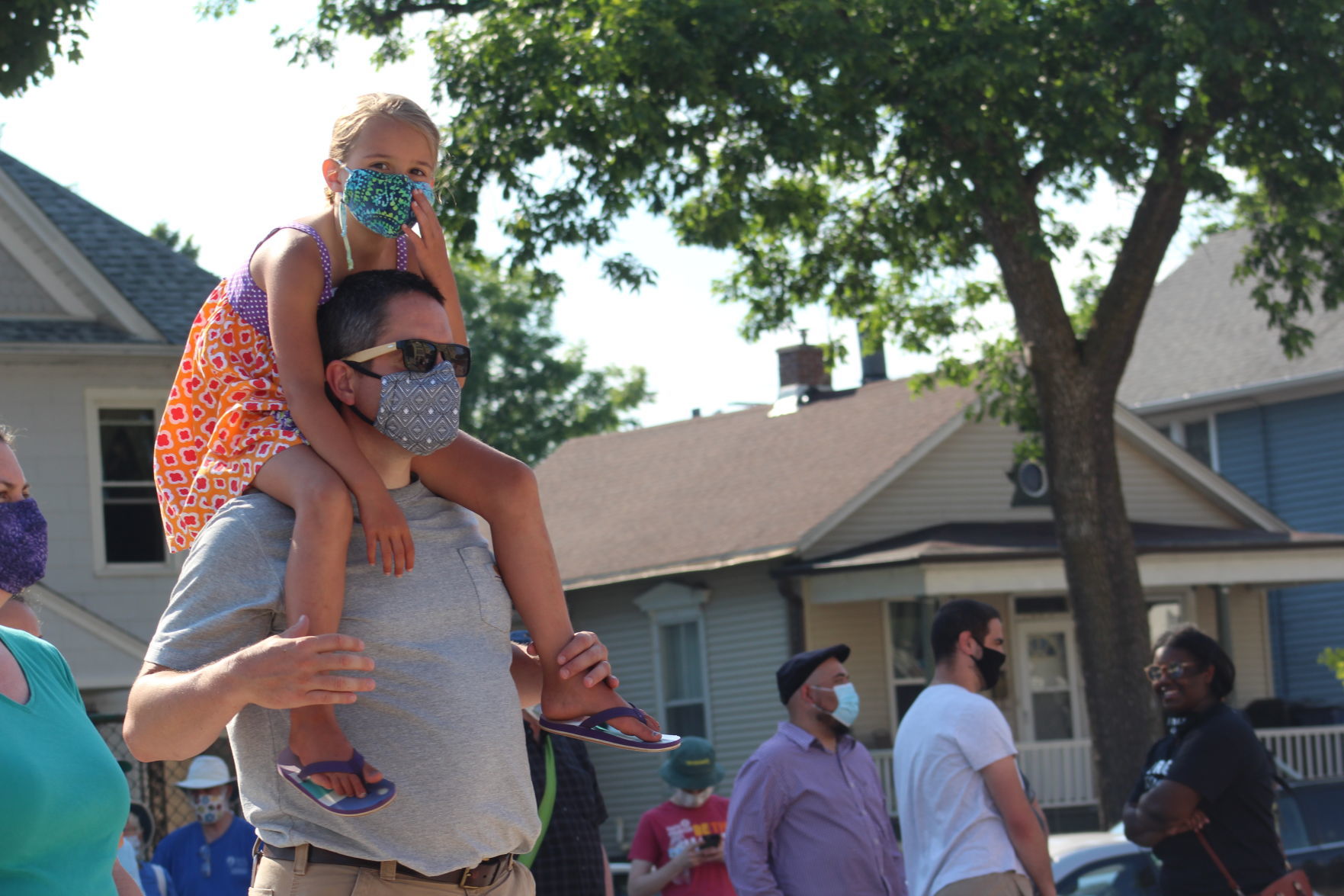 On his shoulders